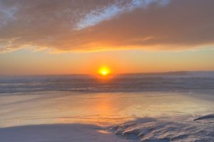 The sun setting over the Pacific Ocean