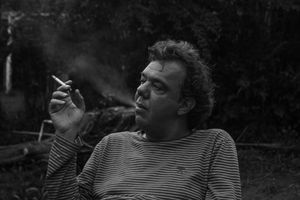 a man smoking a cigarette