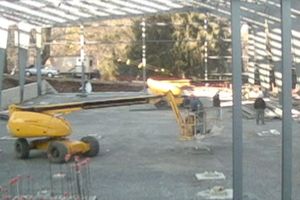 the insides of a construction site for a new gymnasium