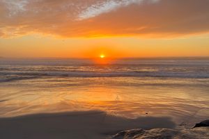 The sun setting over the Pacific Ocean