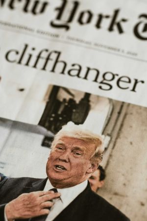 Trump with image of NY Times front page headline